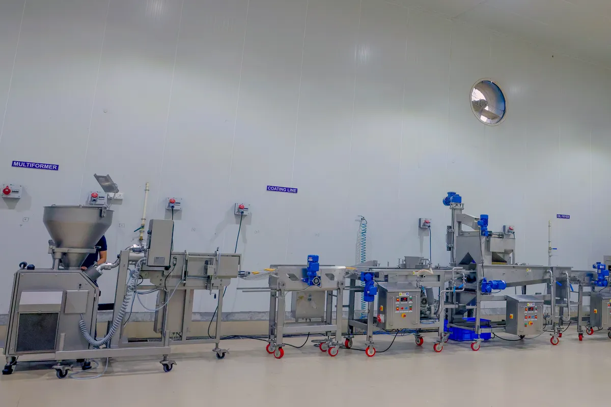 Forming machine and coating line in the hall at Zippy's Rudrapur plant