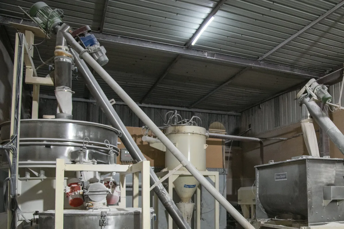 Flour sifter, screw conveyors and blender in the intake room at Zippy's Jaspur plant